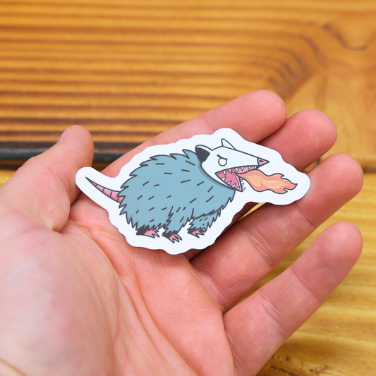 Crude Opossum Breathing Fire Sticker
