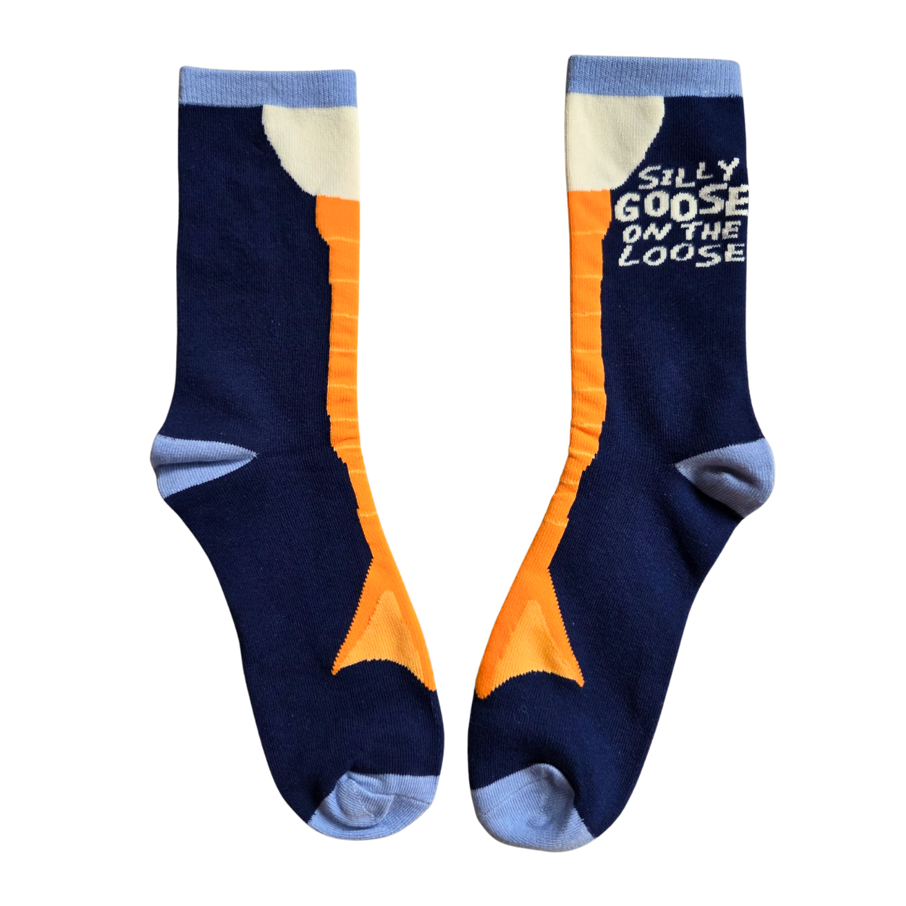 Pair of Silly Goose socks with orange and blue design on a white background
