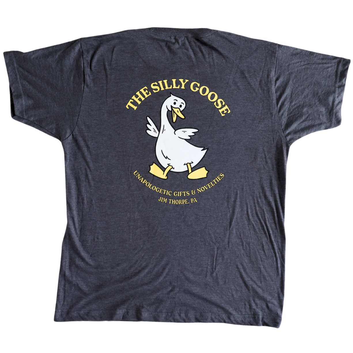 Gray t-shirt with 'The Silly Goose' logo on the back against a white background